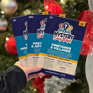Three Mystery Day Trips peel and reveal itinerary cards.
