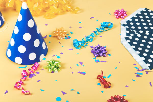 Party decorations on a yellow background.